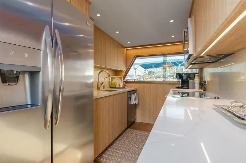  Yacht Photos Pics Modern kitchen in 1981 Hatteras Extended Deckhouse yacht with stainless steel appliances.