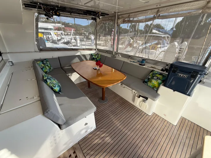 Carolina Breeze Yacht Photos Pics Spacious 2009 Lagoon 500 yacht interior with cushioned seating and wooden table.