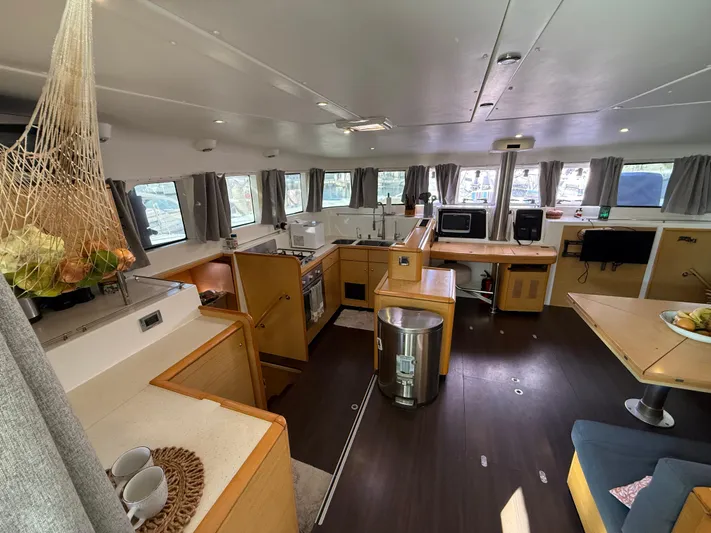 Carolina Breeze Yacht Photos Pics Spacious interior of 2009 Lagoon 500 catamaran with modern kitchen and dining area.