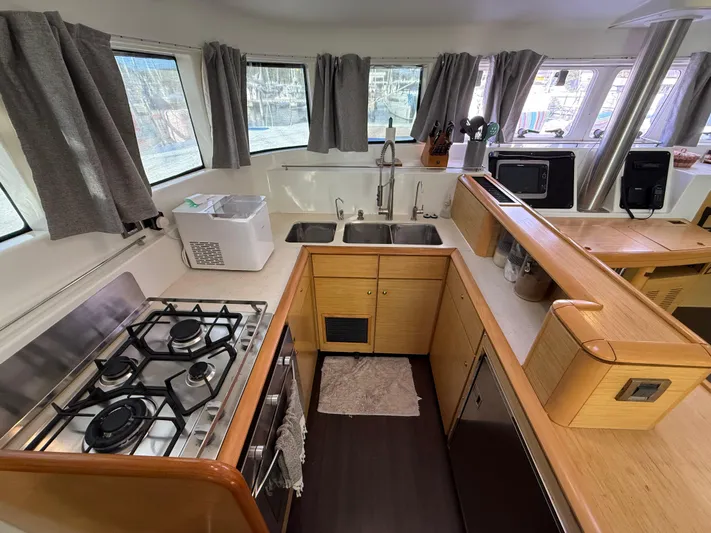 Carolina Breeze Yacht Photos Pics Interior of 2009 Lagoon 500 yacht kitchen with stove, sink, and appliances.