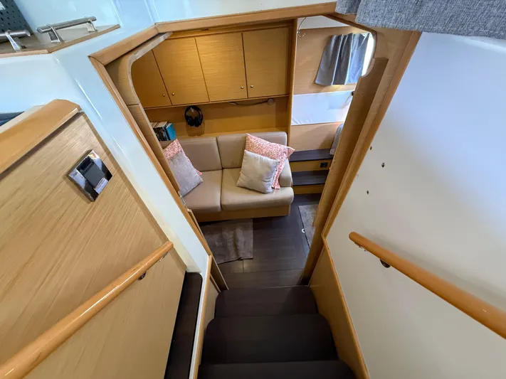 Carolina Breeze Yacht Photos Pics Interior view of 2009 Lagoon 500 yacht, featuring cozy seating and wooden cabinetry.