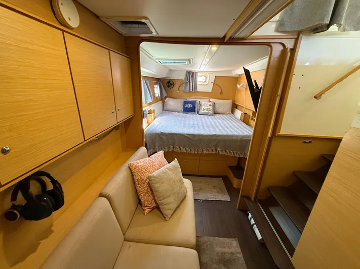 Carolina Breeze Yacht Photos Pics Luxurious interior of 2009 Lagoon 500 catamaran with cozy bedroom and seating area.