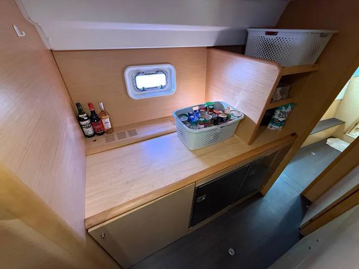 Carolina Breeze Yacht Photos Pics Interior of 2009 Lagoon 500 yacht with wooden cabinetry and storage baskets.