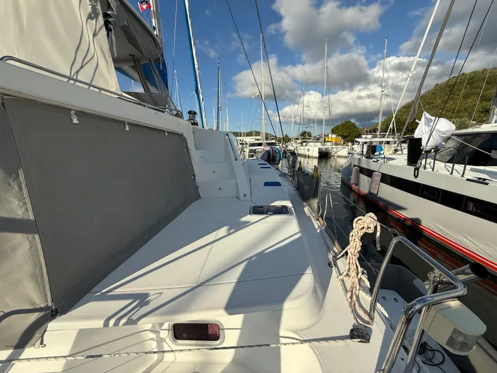 Carolina Breeze Yacht Photos Pics Lagoon 500 catamaran, 2009 model, docked at marina under blue sky.