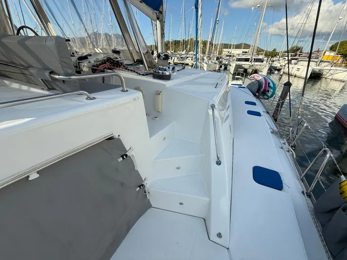 Carolina Breeze Yacht Photos Pics Lagoon 500 catamaran deck, 2009 model, docked in marina with clear skies.