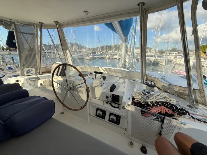 Carolina Breeze Yacht Photos Pics Helm of 2009 Lagoon 500 catamaran with marina view and nautical equipment.