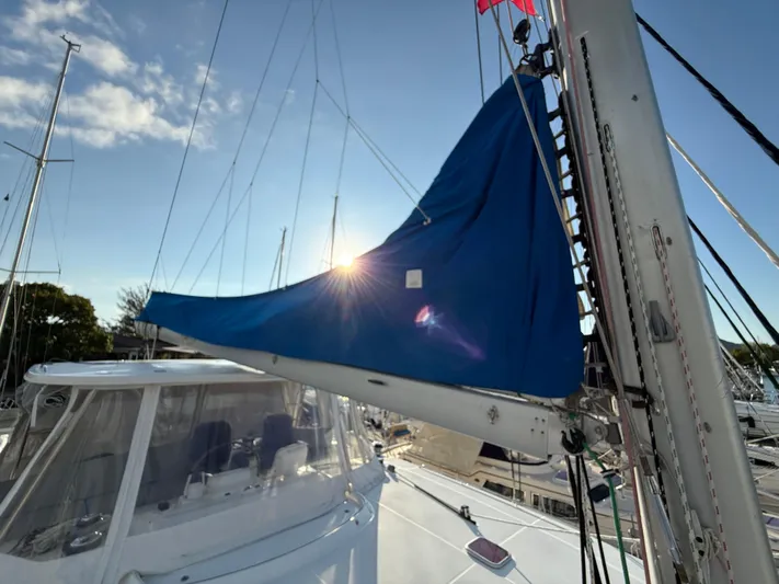 Carolina Breeze Yacht Photos Pics Lagoon 500 sailboat, 2009 model, with blue sail cover and sunlit mast.
