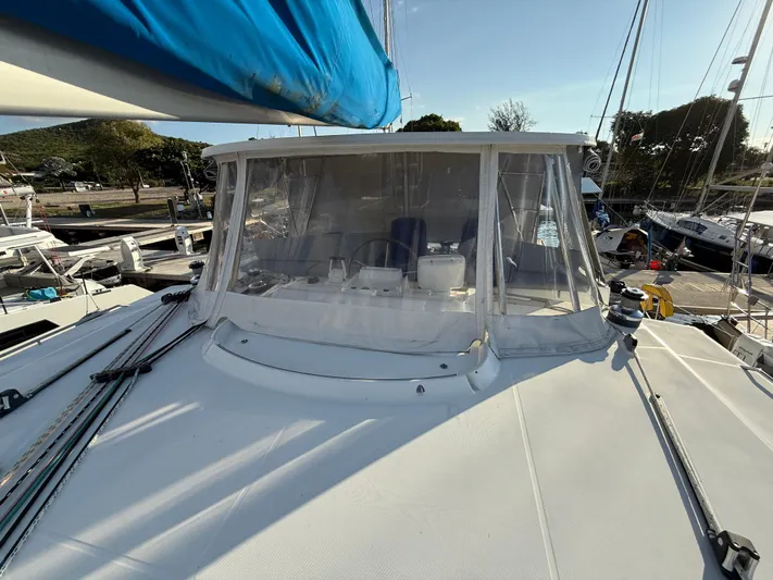 Carolina Breeze Yacht Photos Pics 2009 Lagoon 500 catamaran with blue sail cover, docked at marina.