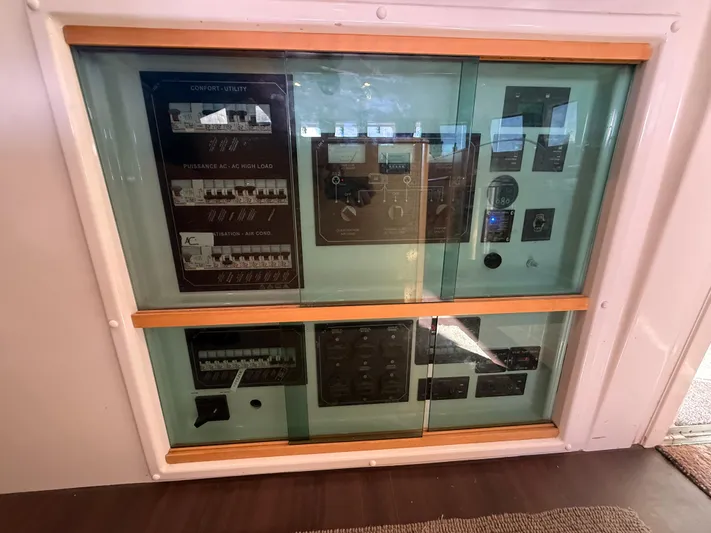 Carolina Breeze Yacht Photos Pics Electrical control panel on a 2009 Lagoon 500 yacht, featuring various switches and gauges.