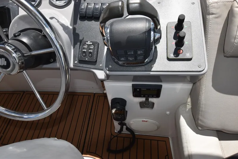  Yacht Photos Pics Helm of 2019 Beneteau Swift Trawler 44 with steering wheel and control panel.