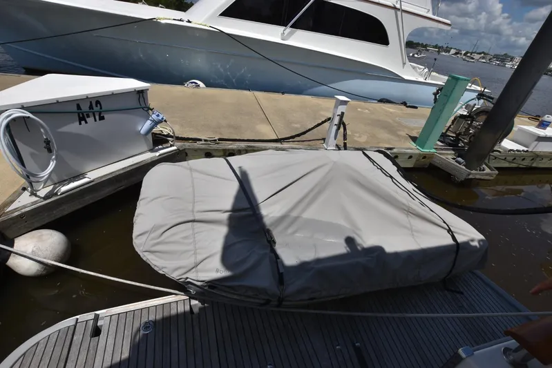  Yacht Photos Pics Docked 2019 Beneteau Swift Trawler 44 with covered equipment, marina setting.