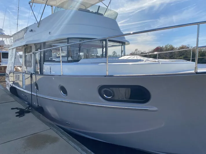  Yacht Photos Pics 2019 Beneteau Swift Trawler 44 docked, showcasing sleek design and modern features.