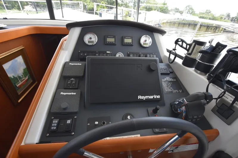  Yacht Photos Pics 2019 Beneteau Swift Trawler 44 helm with Raymarine navigation equipment and controls.