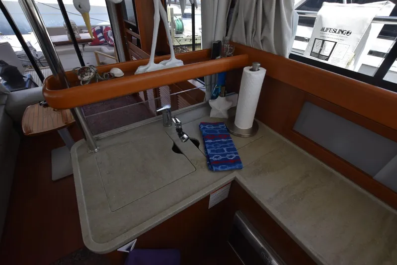  Yacht Photos Pics Interior of 2019 Beneteau Swift Trawler 44, featuring a compact kitchen sink area.