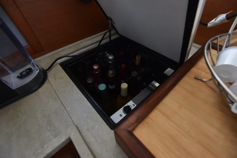  Yacht Photos Pics Hidden wine storage in 2019 Beneteau Swift Trawler 44 kitchen area.