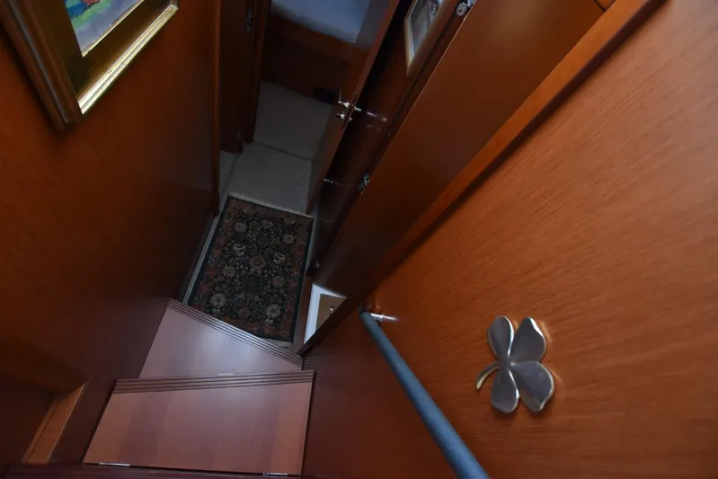  Yacht Photos Pics Interior view of 2019 Beneteau Swift Trawler 44, featuring wooden stairs and decorative elements.
