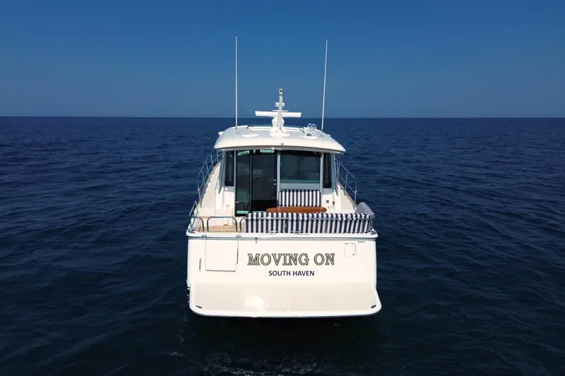 Moving On Yacht Photos Pics 2022 Sabre 48 Salon Express yacht "Moving On" on open sea, rear view.