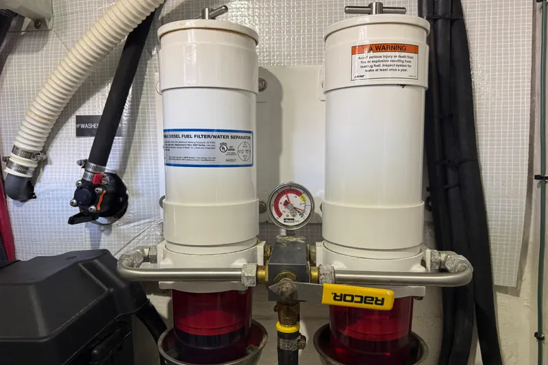 Moving On Yacht Photos Pics Engine room of 2022 Sabre 48 Salon Express with fuel filter system.