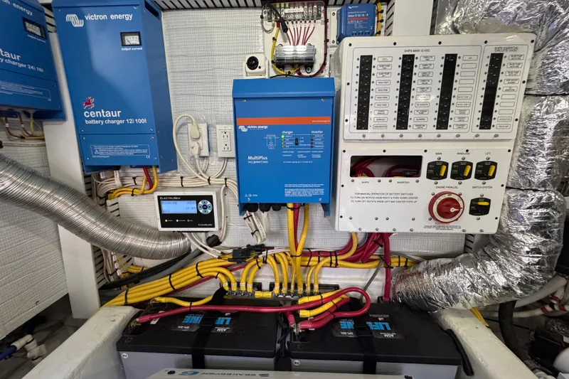 Moving On Yacht Photos Pics Electrical system of 2022 Sabre 48 Salon Express with chargers and control panel.