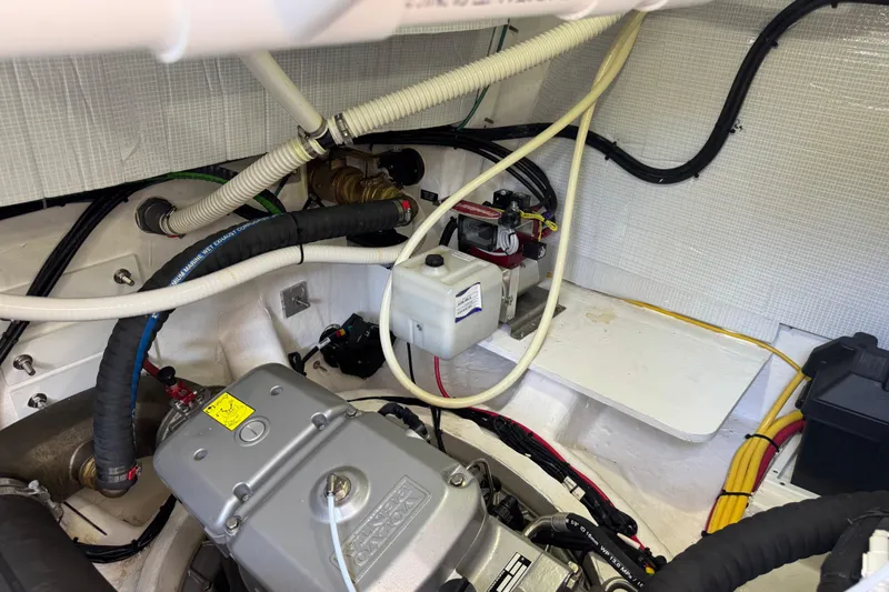 Moving On Yacht Photos Pics Engine room of 2022 Sabre 48 Salon Express with visible wiring and components.