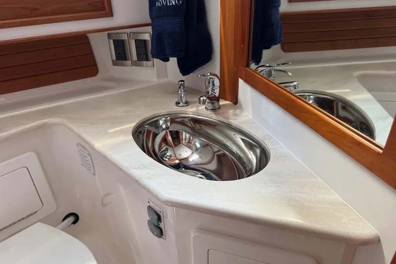 Moving On Yacht Photos Pics Luxurious bathroom sink in 2022 Sabre 48 Salon Express yacht, featuring sleek design and modern fixtures.