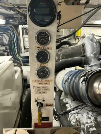 Code Vessel Yacht Photos Pics Engine room of 1989 Hatteras Convertible boat with gauges and machinery.