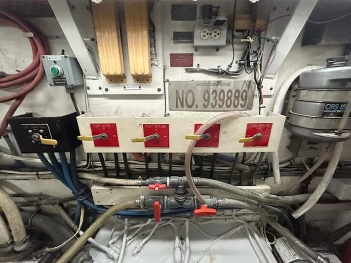 Code Vessel Yacht Photos Pics Engine room of 1989 Hatteras Convertible boat with control panel and wiring.