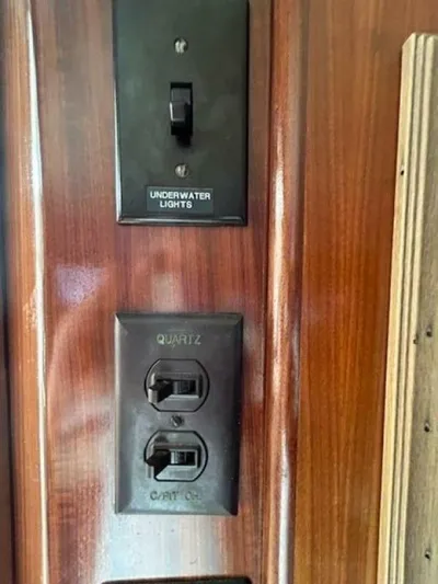 Code Vessel Yacht Photos Pics Switch panel on 1989 Hatteras Convertible yacht with underwater lights and quartz controls.