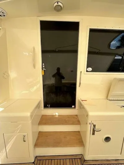 Code Vessel Yacht Photos Pics 1989 Hatteras Convertible yacht interior with steps and cabinetry.