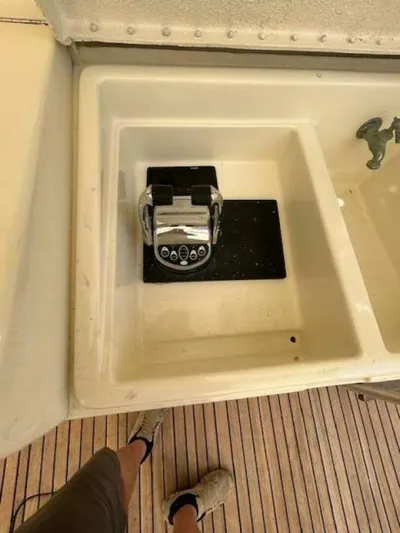 Code Vessel Yacht Photos Pics 1989 Hatteras Convertible boat sink with faucet and control panel.