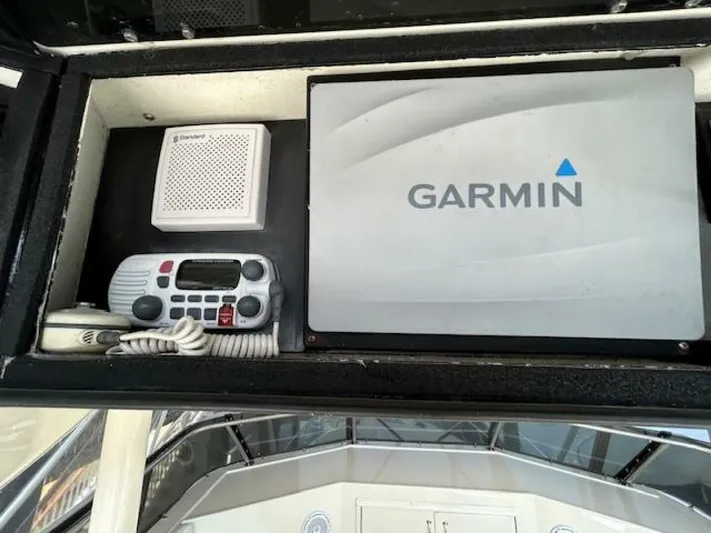 Code Vessel Yacht Photos Pics Garmin navigation system on 1989 Hatteras Convertible boat dashboard.