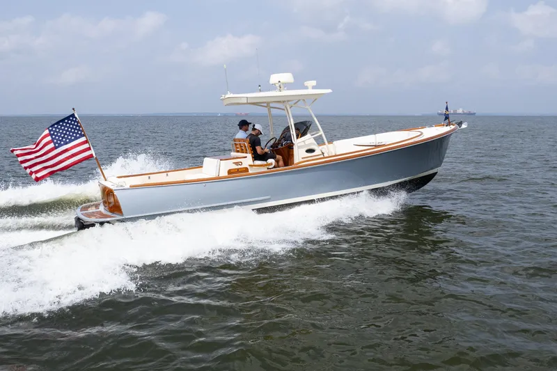 Sea Bug Yacht Photos Pics 2017 Hinckley Talaria 29C cruising on open water with American flag.