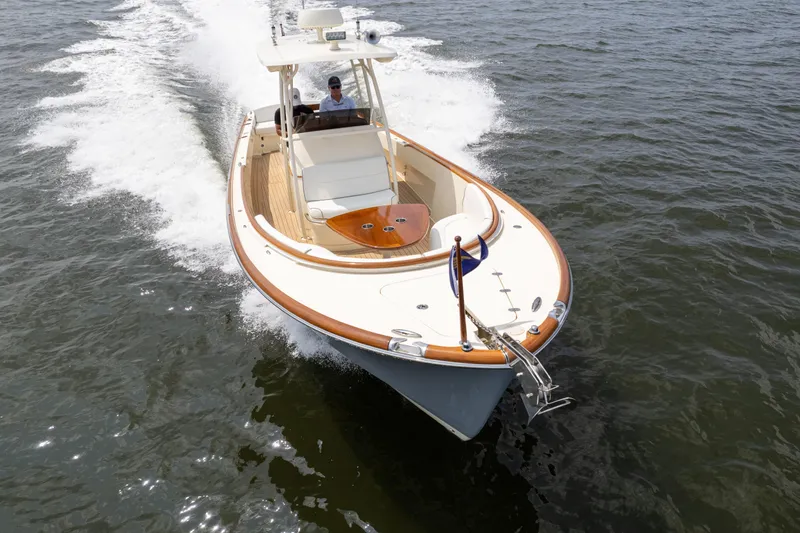 Sea Bug Yacht Photos Pics 2017 Hinckley Talaria 29C cruising on open water, showcasing elegant design and craftsmanship.
