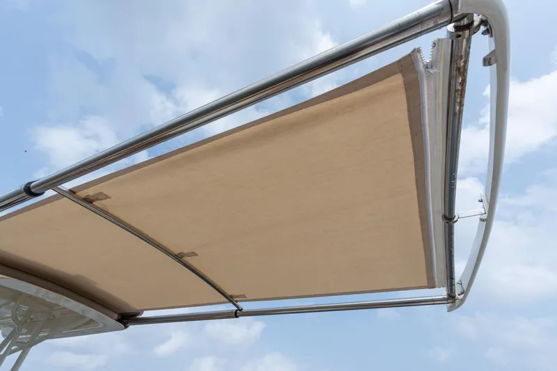 Sea Bug Yacht Photos Pics 2017 Hinckley Talaria 29C boat canopy against a cloudy sky.