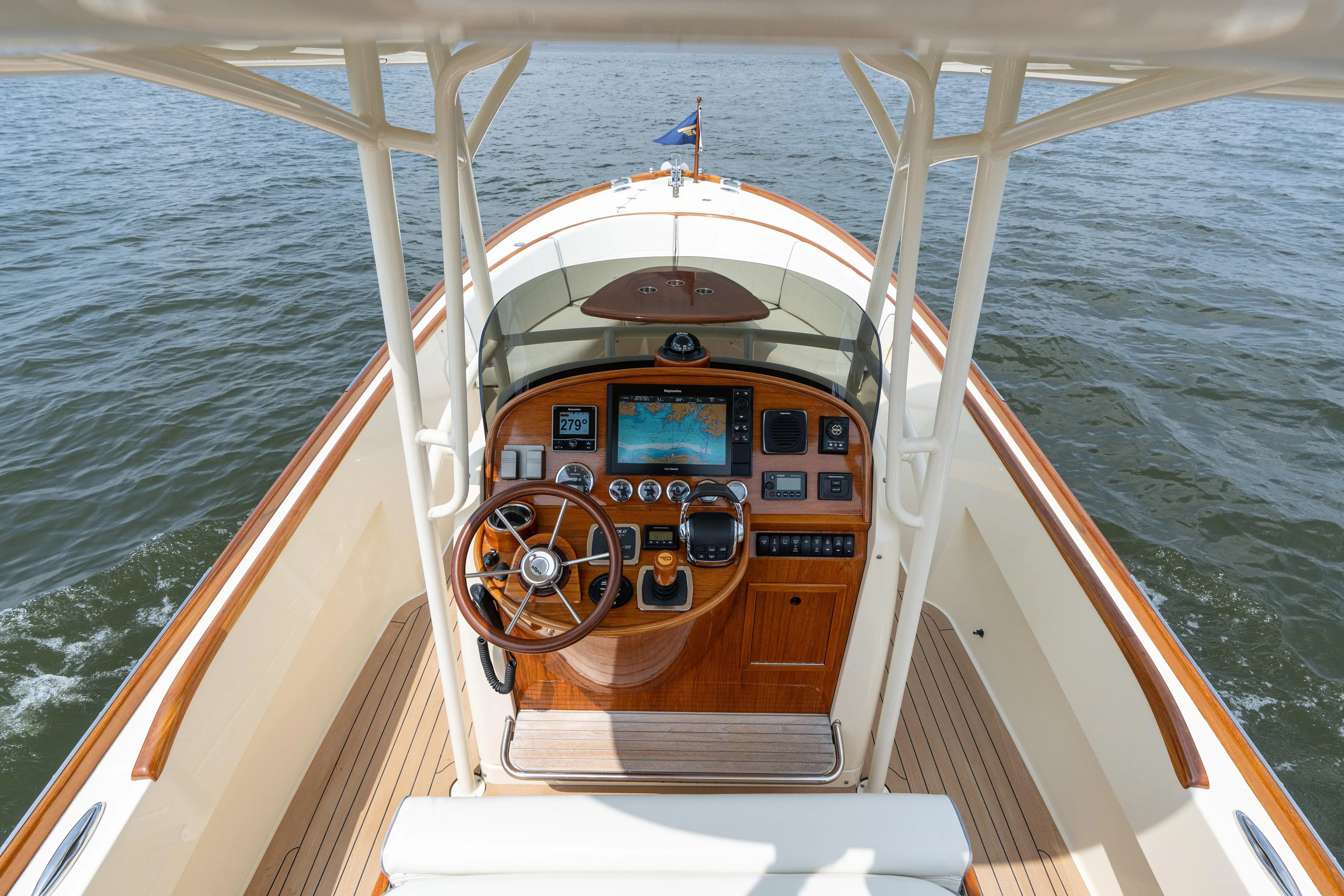 Sea Bug Yacht Photos Pics 2017 Hinckley Talaria 29C boat helm with wooden dashboard and navigation equipment.