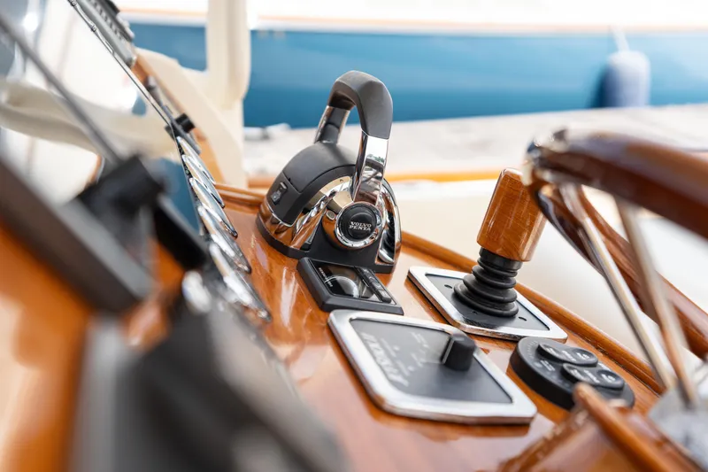 Sea Bug Yacht Photos Pics Helm controls of 2017 Hinckley Talaria 29C, featuring polished wood and modern instruments.
