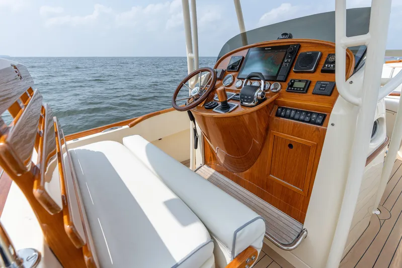 Sea Bug Yacht Photos Pics 2017 Hinckley Talaria 29C boat helm with wooden dashboard and ocean view.