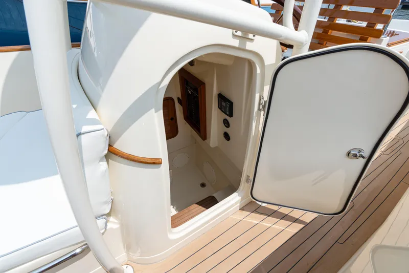 Sea Bug Yacht Photos Pics 2017 Hinckley Talaria 29C boat interior with open door, showcasing elegant wood and white design.