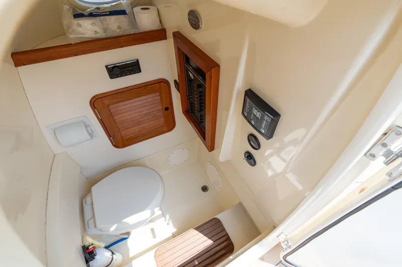 Sea Bug Yacht Photos Pics 2017 Hinckley Talaria 29C boat interior with toilet and control panel.