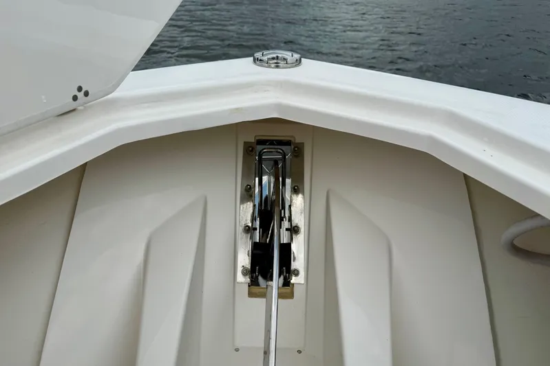 Seakeeper Yacht Photos Pics Bow view of 2020 Pursuit S 408 Sport boat with anchor mechanism.