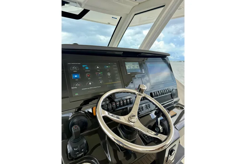 Seakeeper Yacht Photos Pics Helm of 2020 Pursuit S 408 Sport boat with advanced navigation displays.