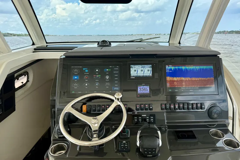 Seakeeper Yacht Photos Pics 2020 Pursuit S 408 Sport boat dashboard with advanced navigation and control systems.