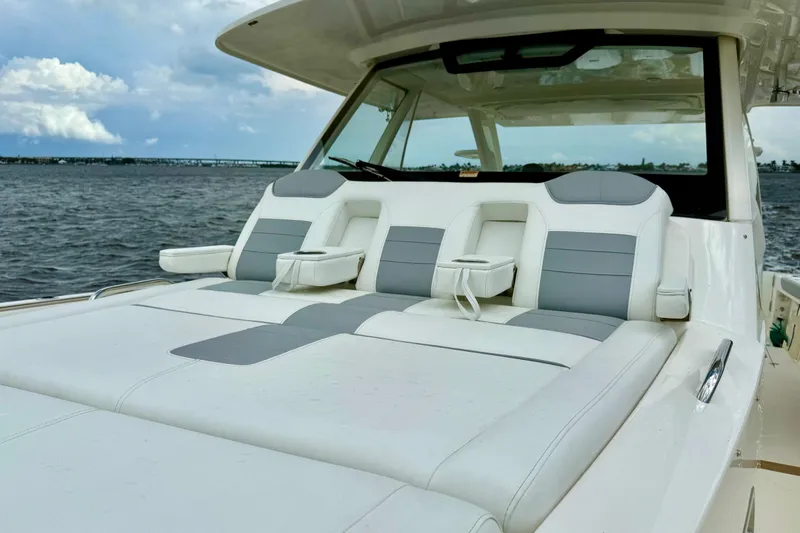Seakeeper Yacht Photos Pics 2020 Pursuit S 408 Sport boat with luxurious seating on open water.