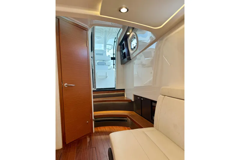 Seakeeper Yacht Photos Pics Interior of 2020 Pursuit S 408 Sport boat with wooden flooring and modern design.
