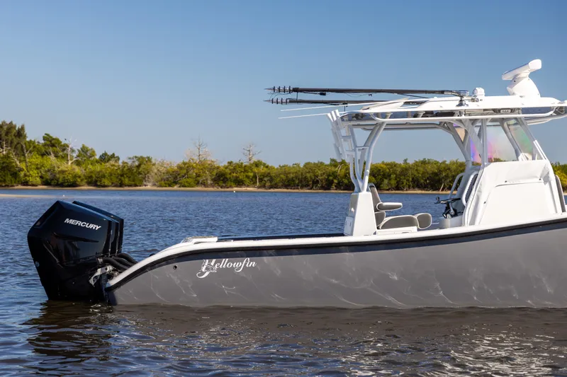 Bid Time 2 Yacht Photos Pics 2023 Yellowfin 36 Offshore boat on calm water with Mercury engine.