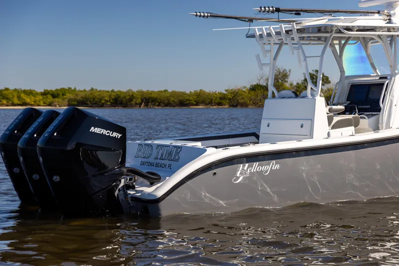 Bid Time 2 Yacht Photos Pics 2023 Yellowfin 36 Offshore boat with triple Mercury engines on calm water.