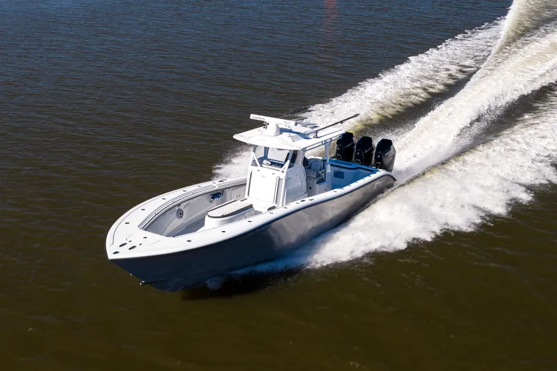 Bid Time 2 Yacht Photos Pics 2023 Yellowfin 36 Offshore boat cruising on open water.