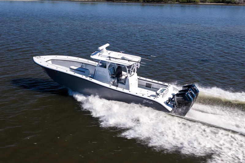Bid Time 2 Yacht Photos Pics 2023 Yellowfin 36 Offshore boat cruising on open water at high speed.