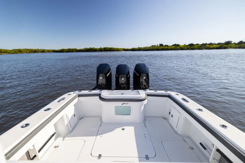 Bid Time 2 Yacht Photos Pics 2023 Yellowfin 36 Offshore boat with triple engines on calm water.