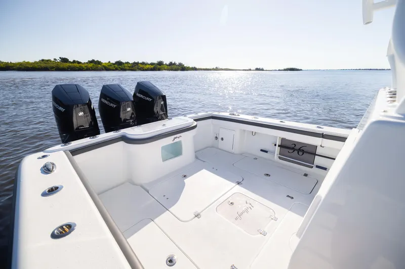 Bid Time 2 Yacht Photos Pics 2023 Yellowfin 36 Offshore boat with triple Mercury engines on calm water.